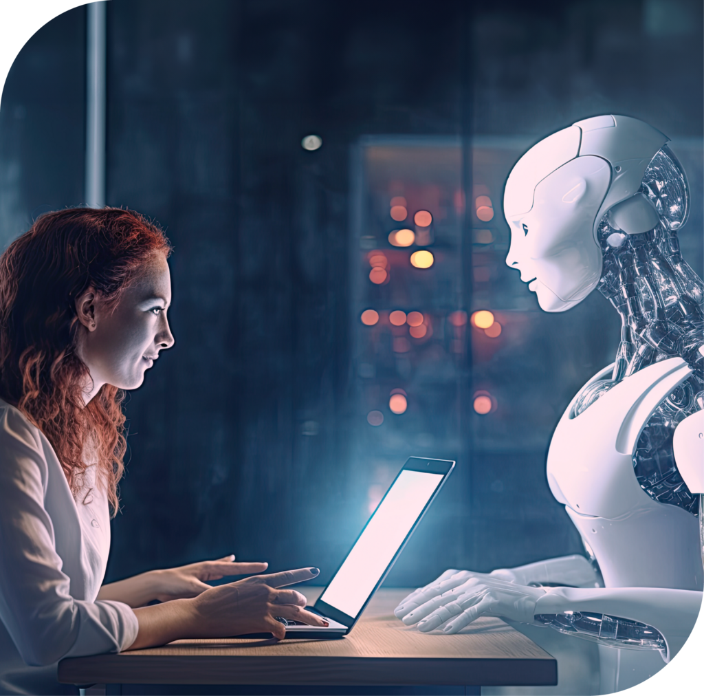 Frau arbeitet am Laptop und sitzt einem Roboter gegenüber.